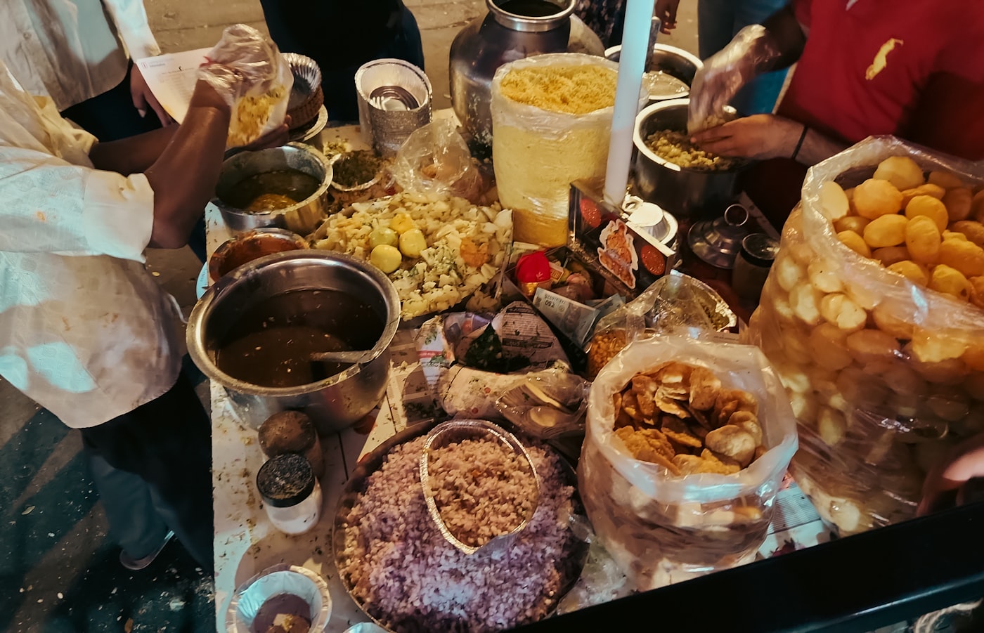 Street food vendor carefully preparing fresh snacks